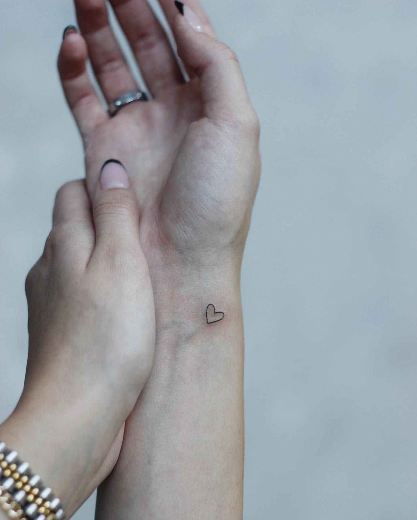 tiny heart tattoo