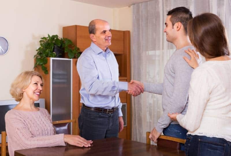 woman introducing her boyfriend to parents