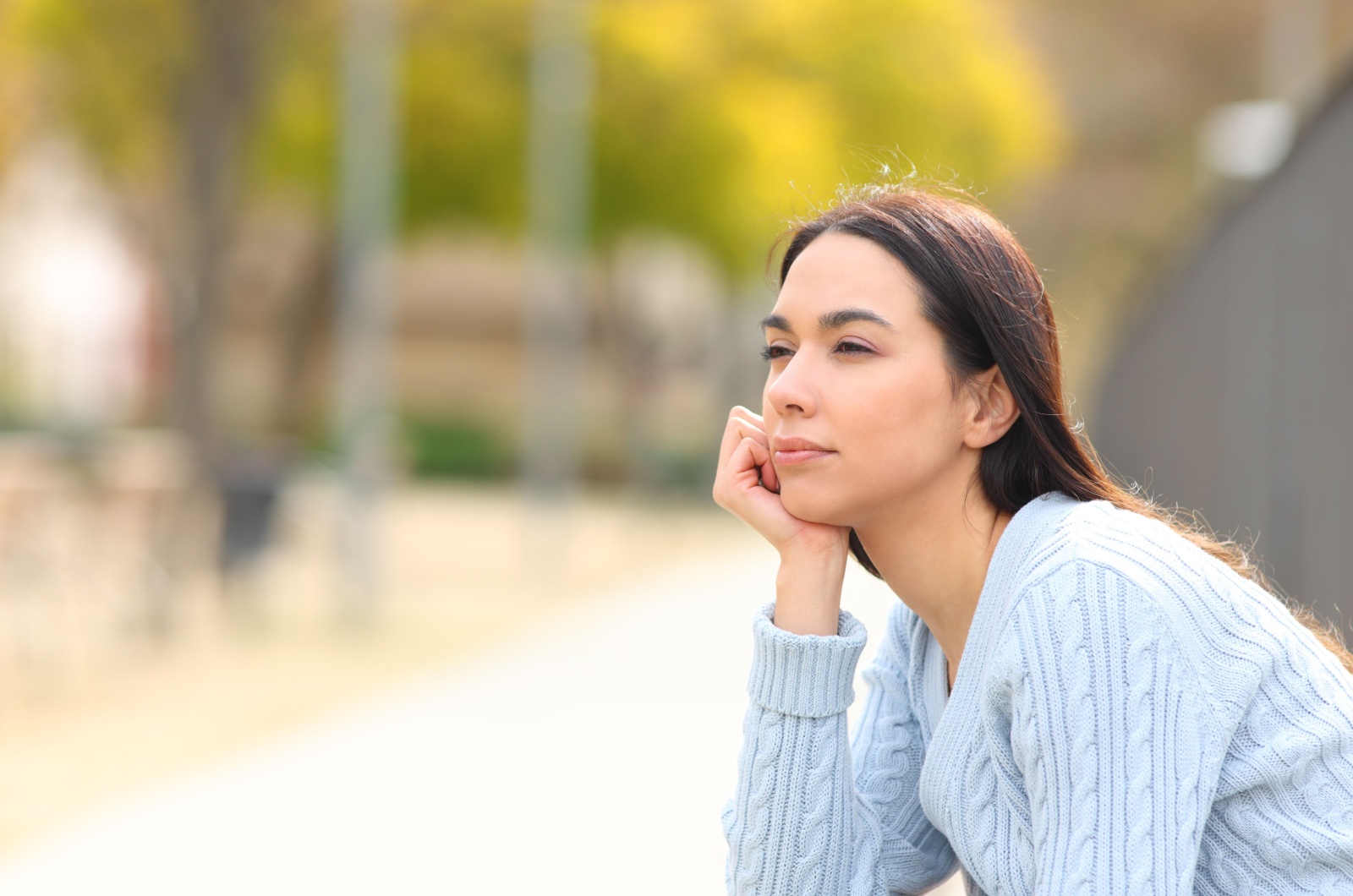 woman looking into distance thinking