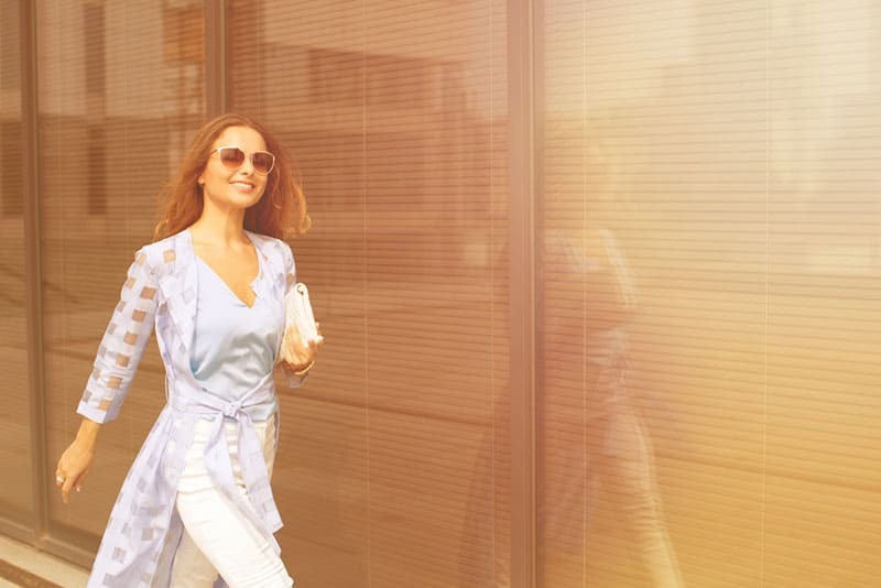 young woman walking with smile