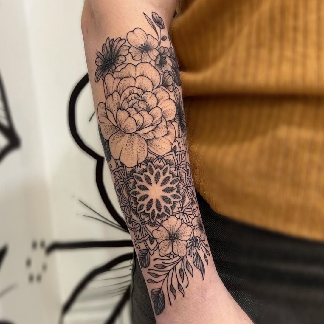 dot work half sleeve tattoo