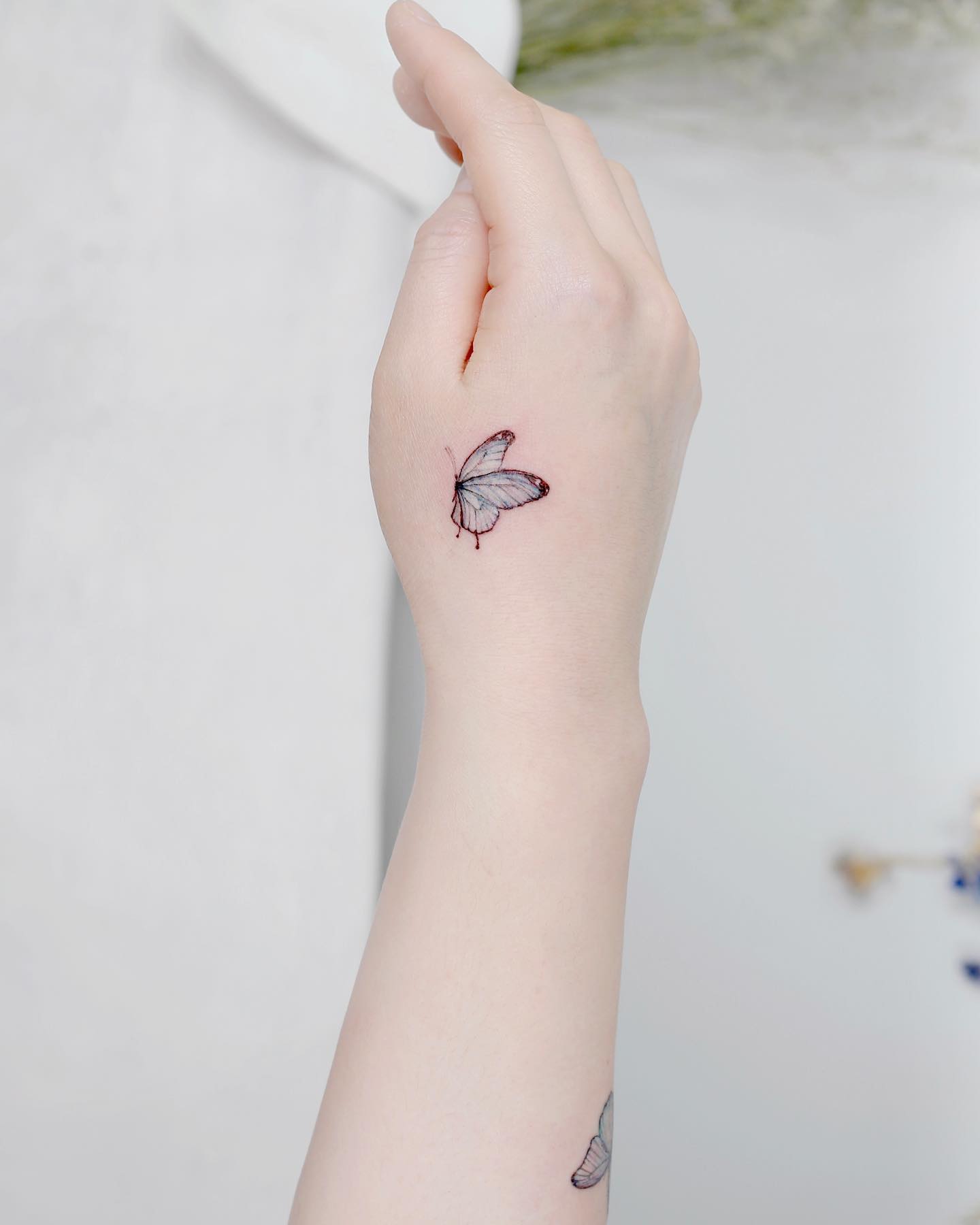 cute butterfly hand tattoo