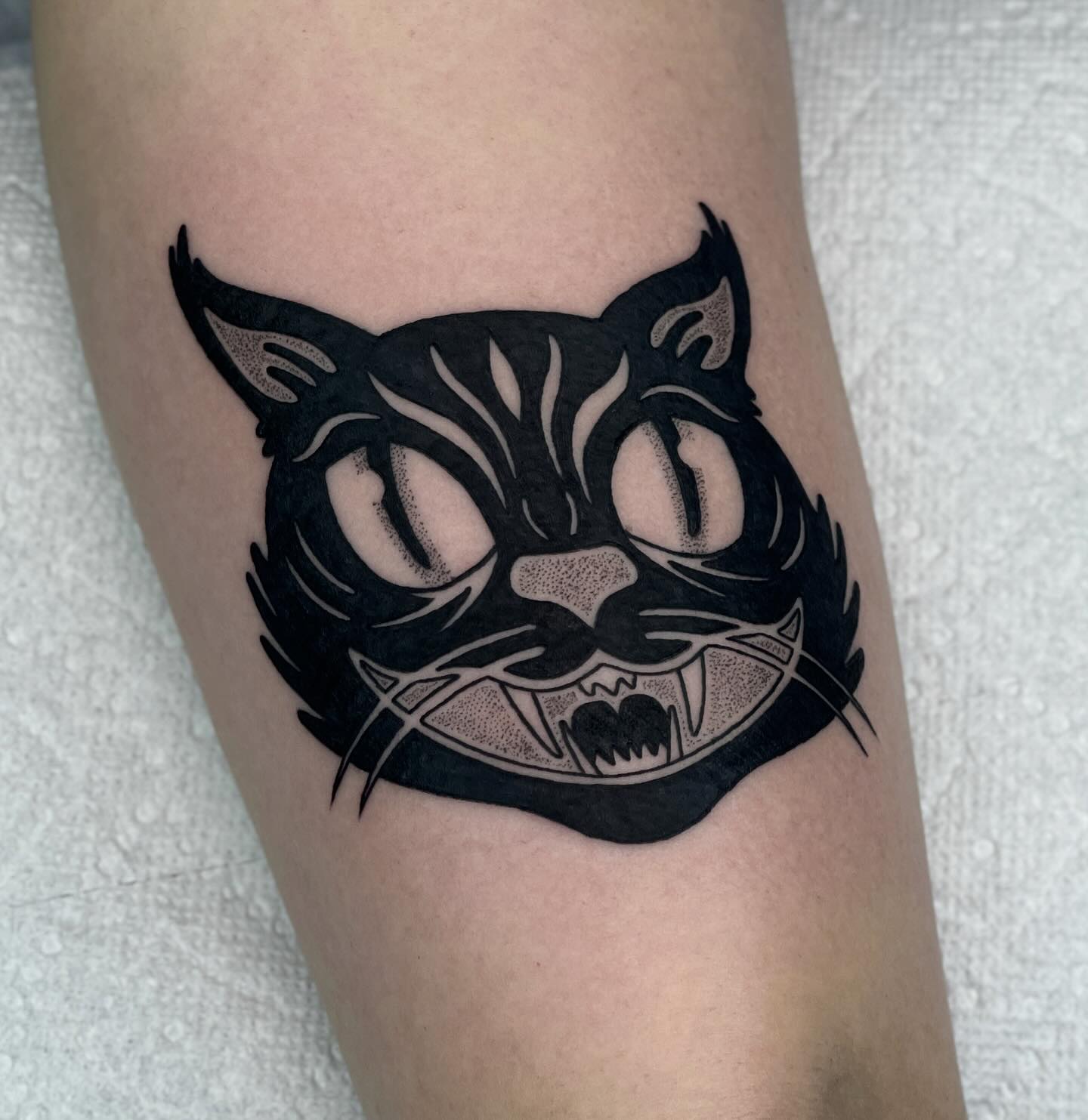 halloween style cat tattoo