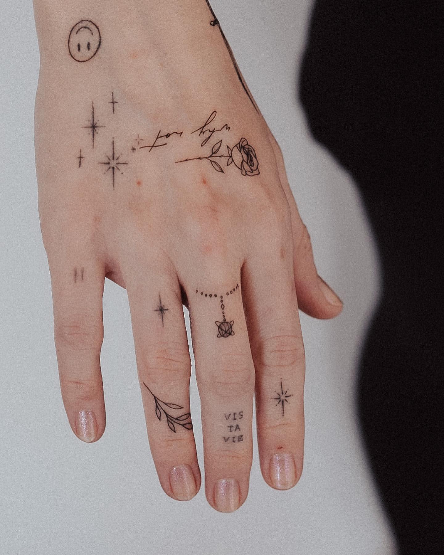 patchwork hand tattoo