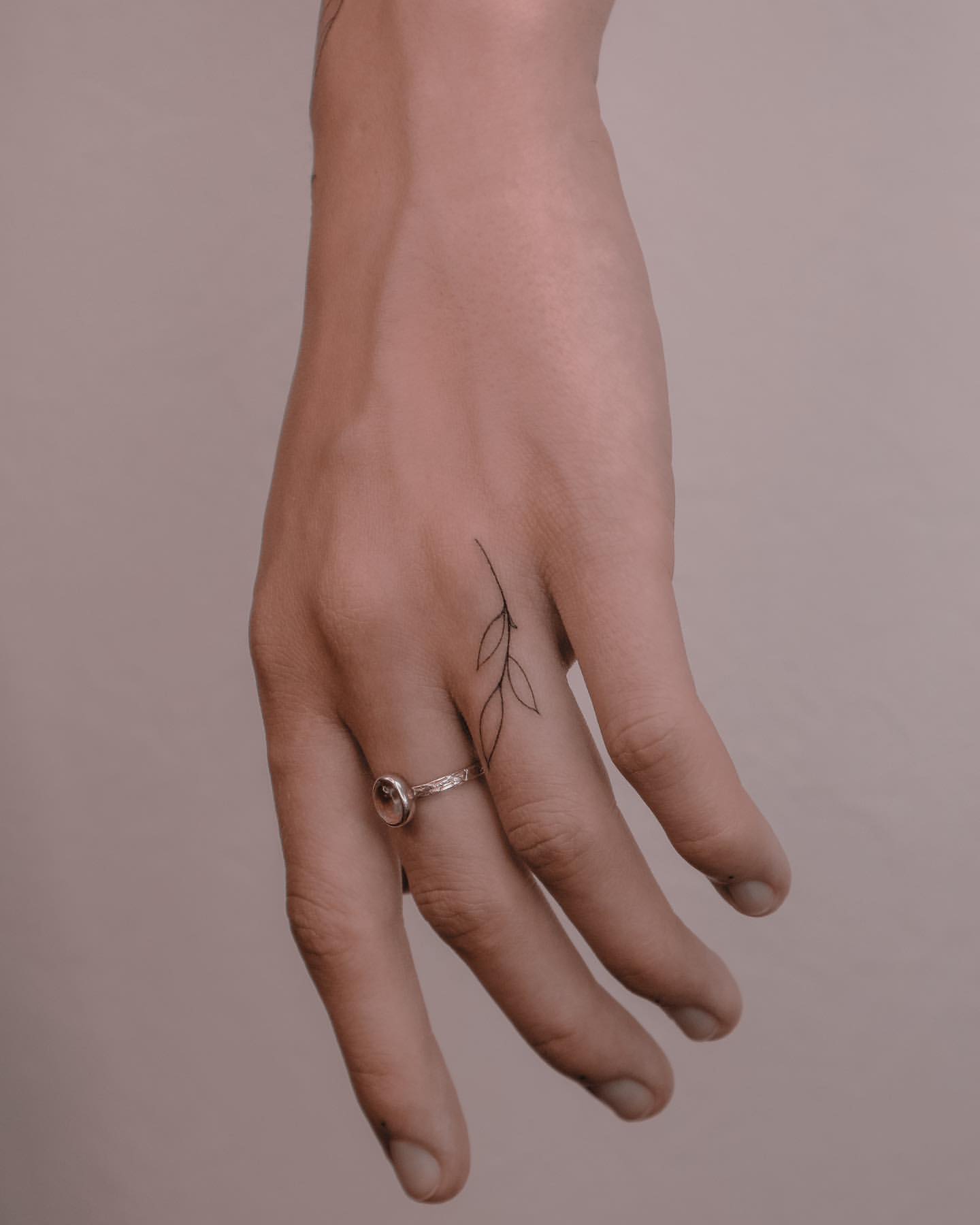 leaf finger tattoo