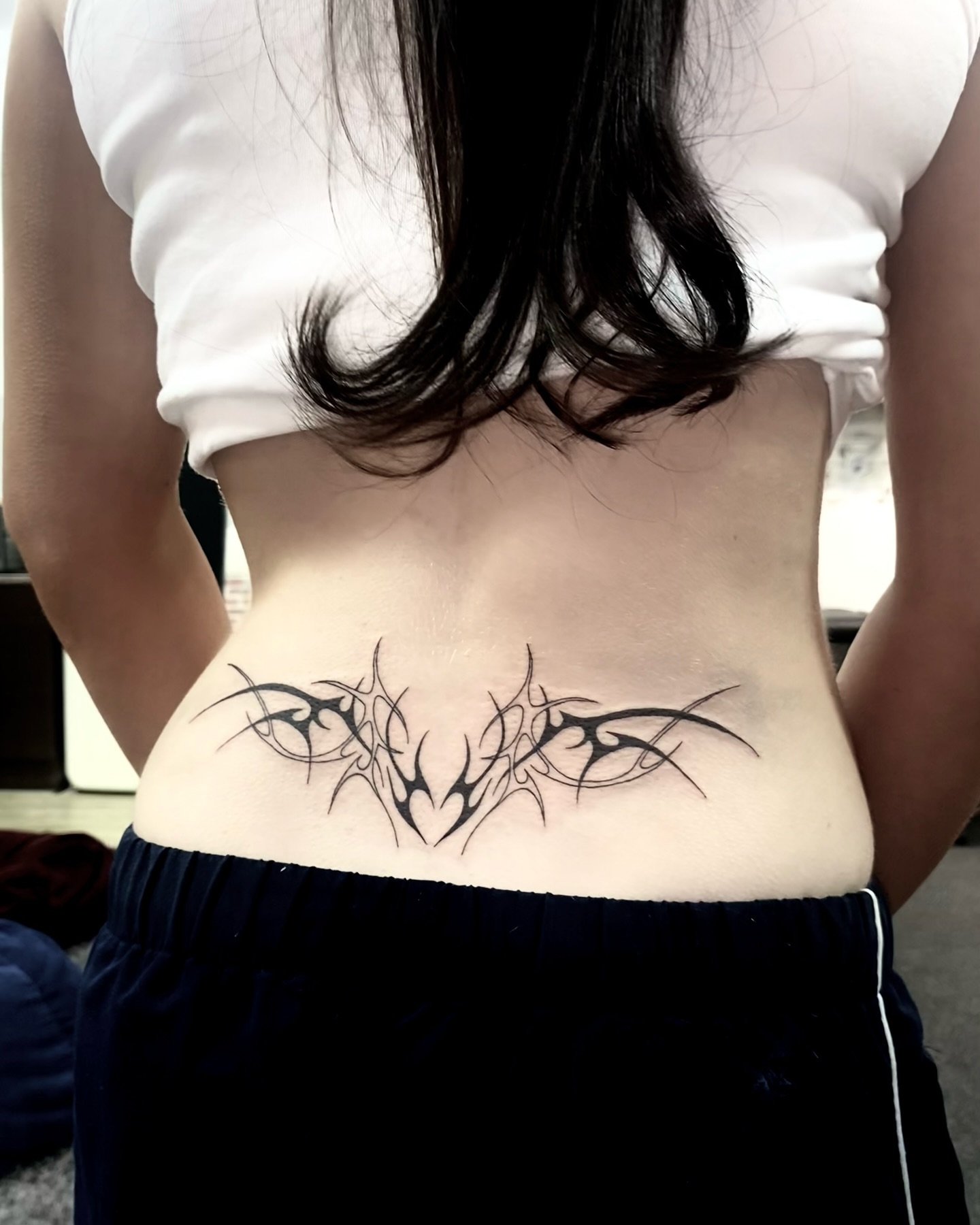 cyber sigil lower back tattoo