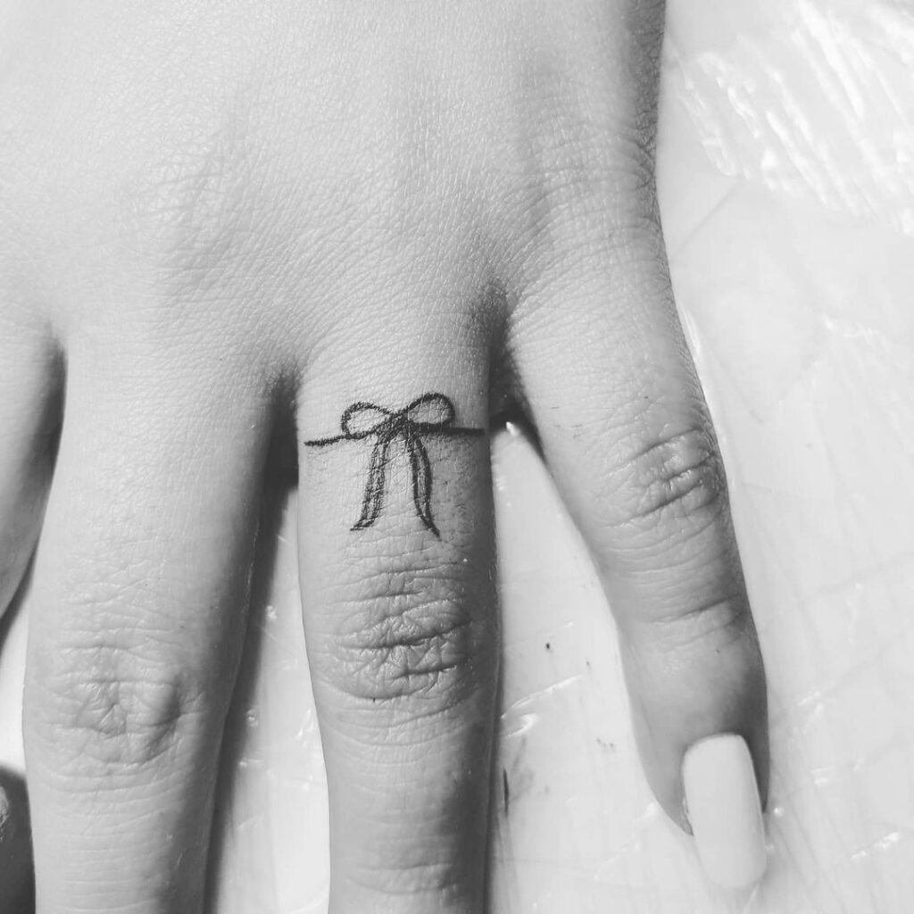 Bow Small Finger Tattoo