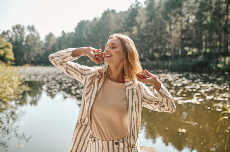 happy woman by the lake