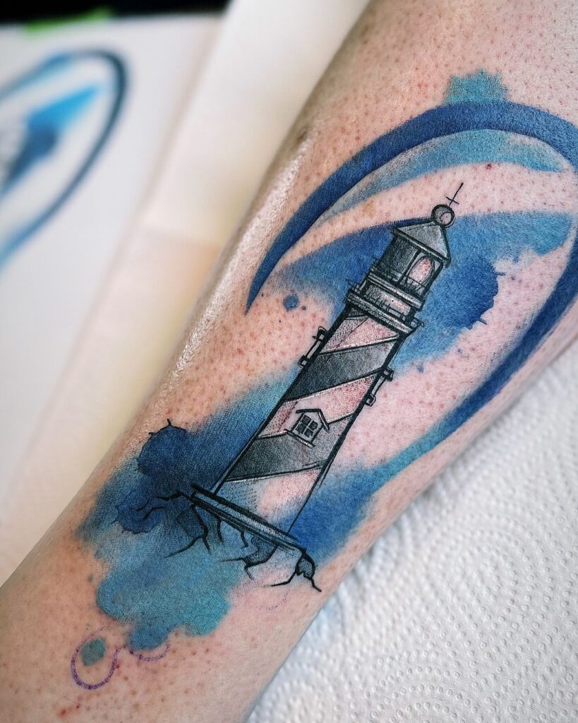 Tatuaje de un faro en acuarela