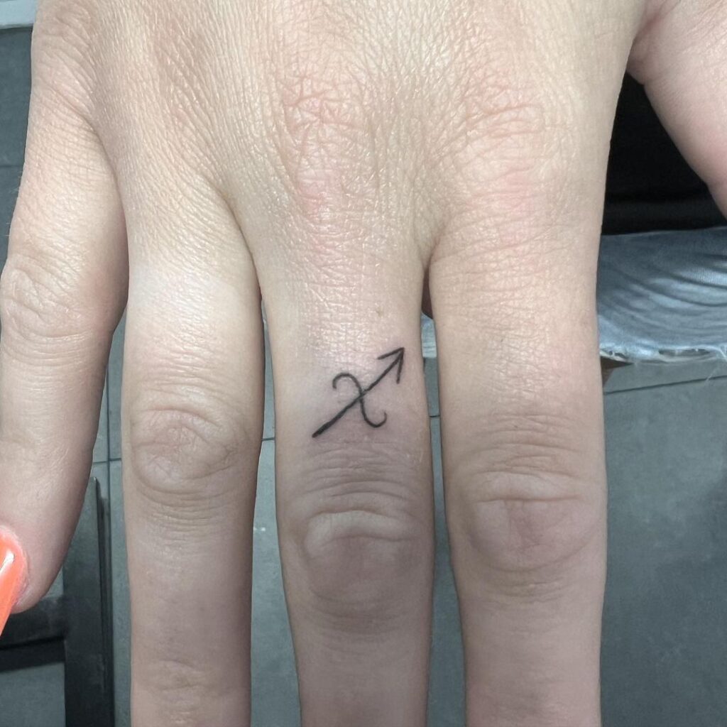 Astro Arrow Finger Tattoo