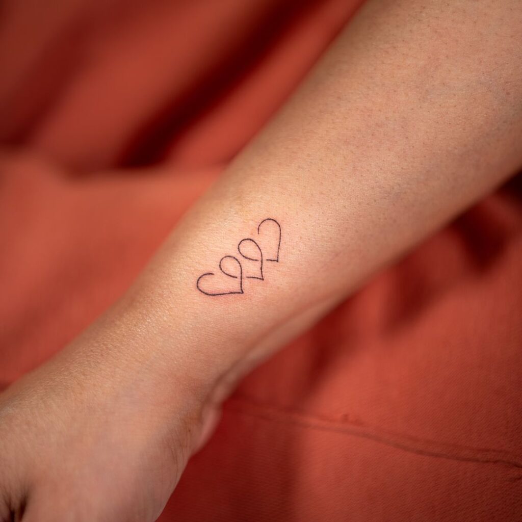 Intertwined Tiny Hearts Tattoo