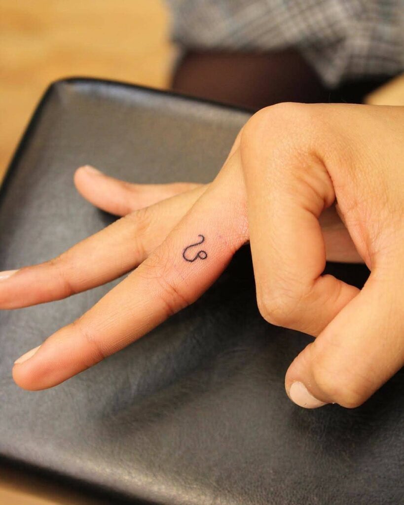 Tiny Finger Zodiac Symbol Tattoo