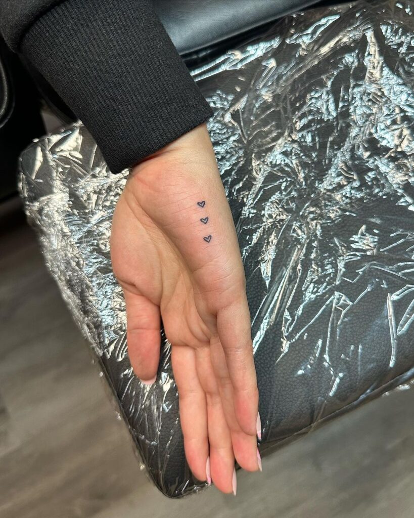 Tiny Hearts Hand Tattoo