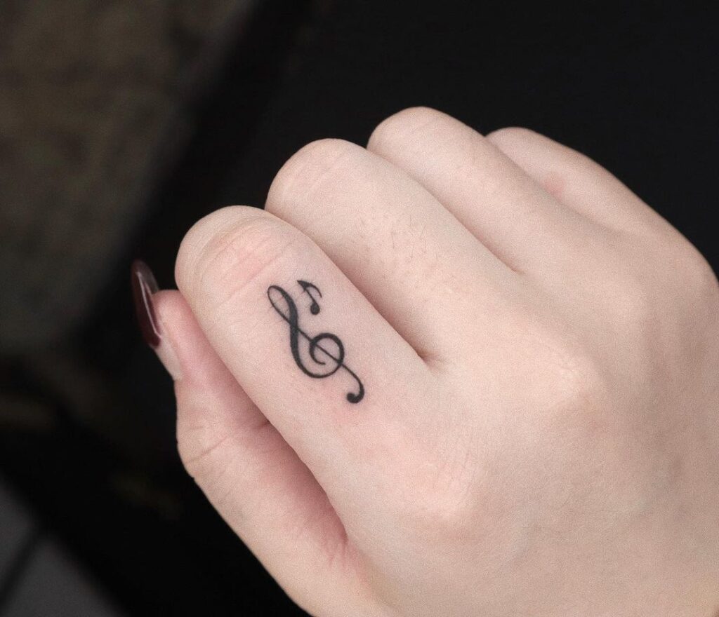 Treble Clef Small Finger Tattoo