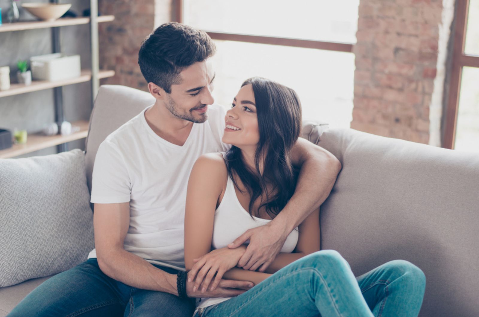 couple hugging on the couch