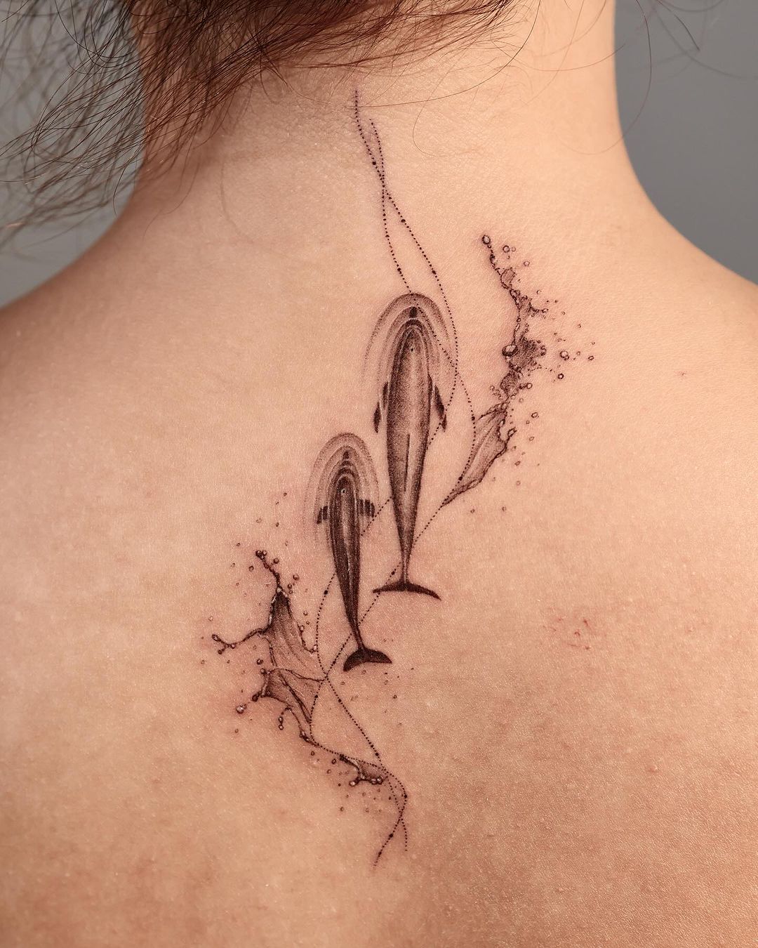 dolphins back tattoo