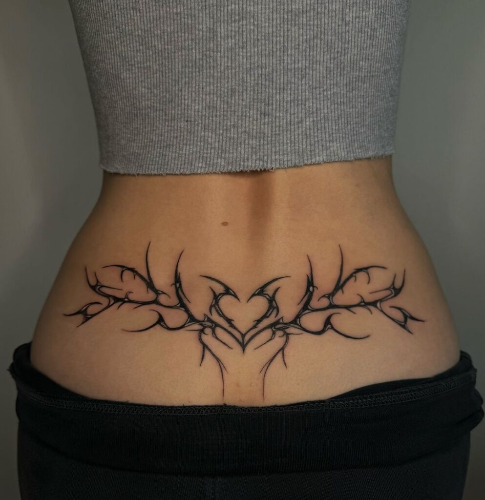 tatuaggio funky heart lower back