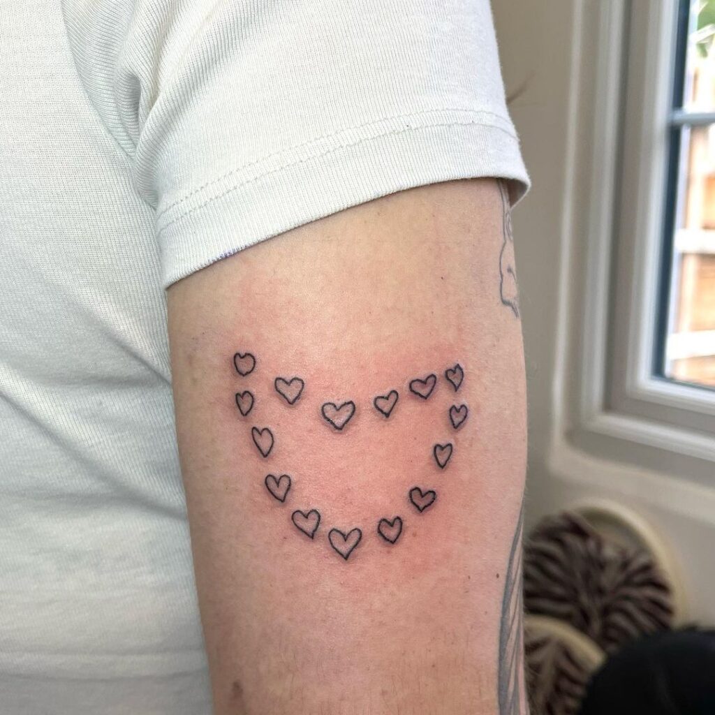 funky heart made of hearts tattoo