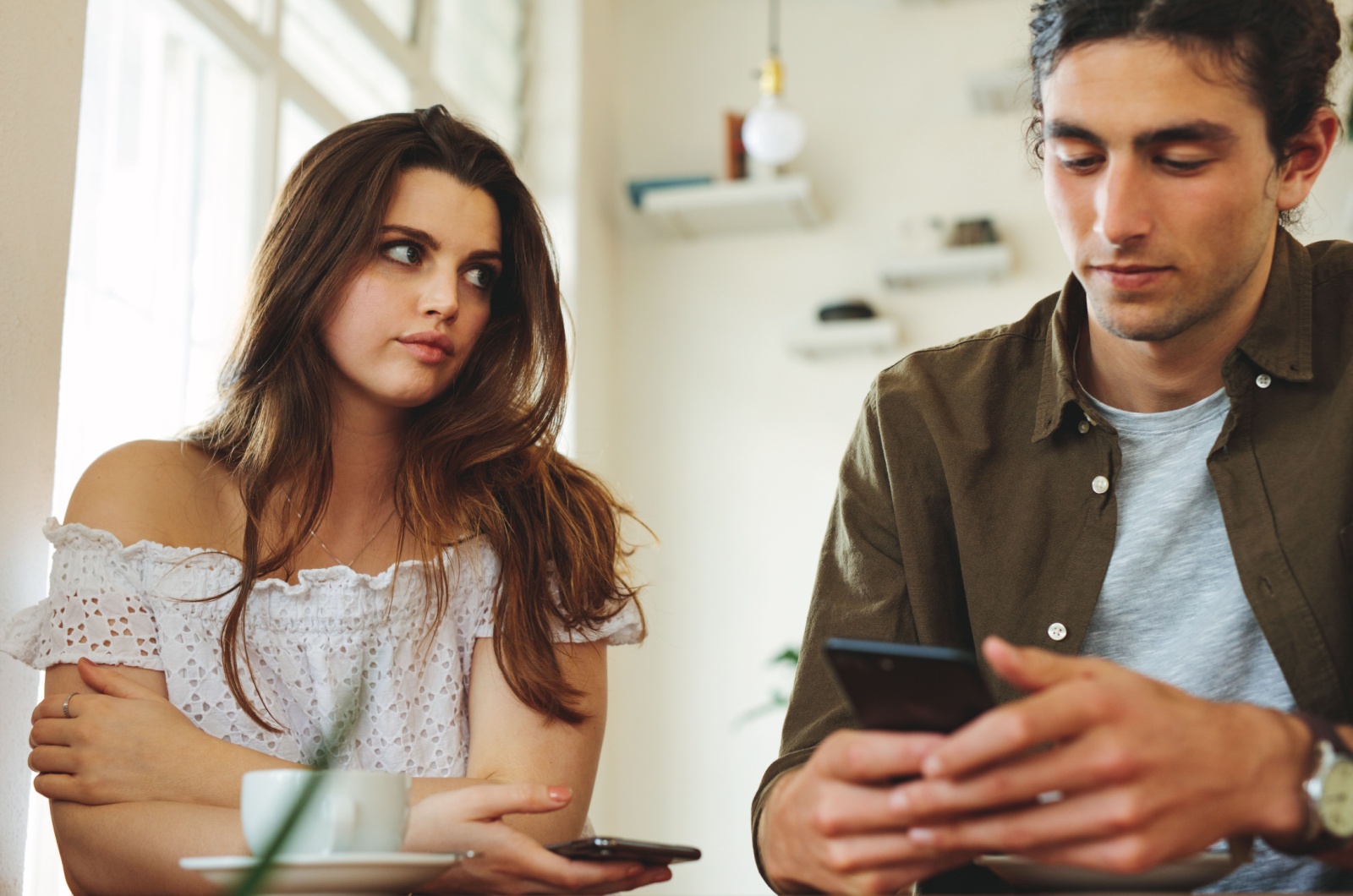 man using phone on a date