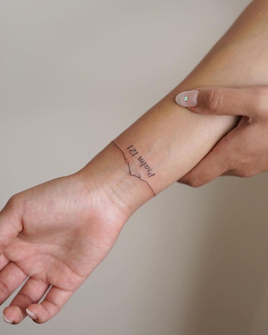 minimalist tattoo with religious significance 
