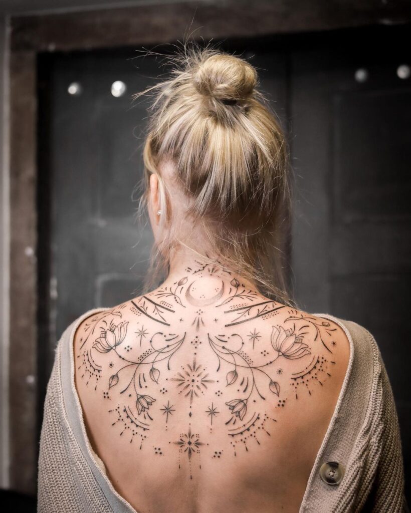 ornamental upper back tattoo