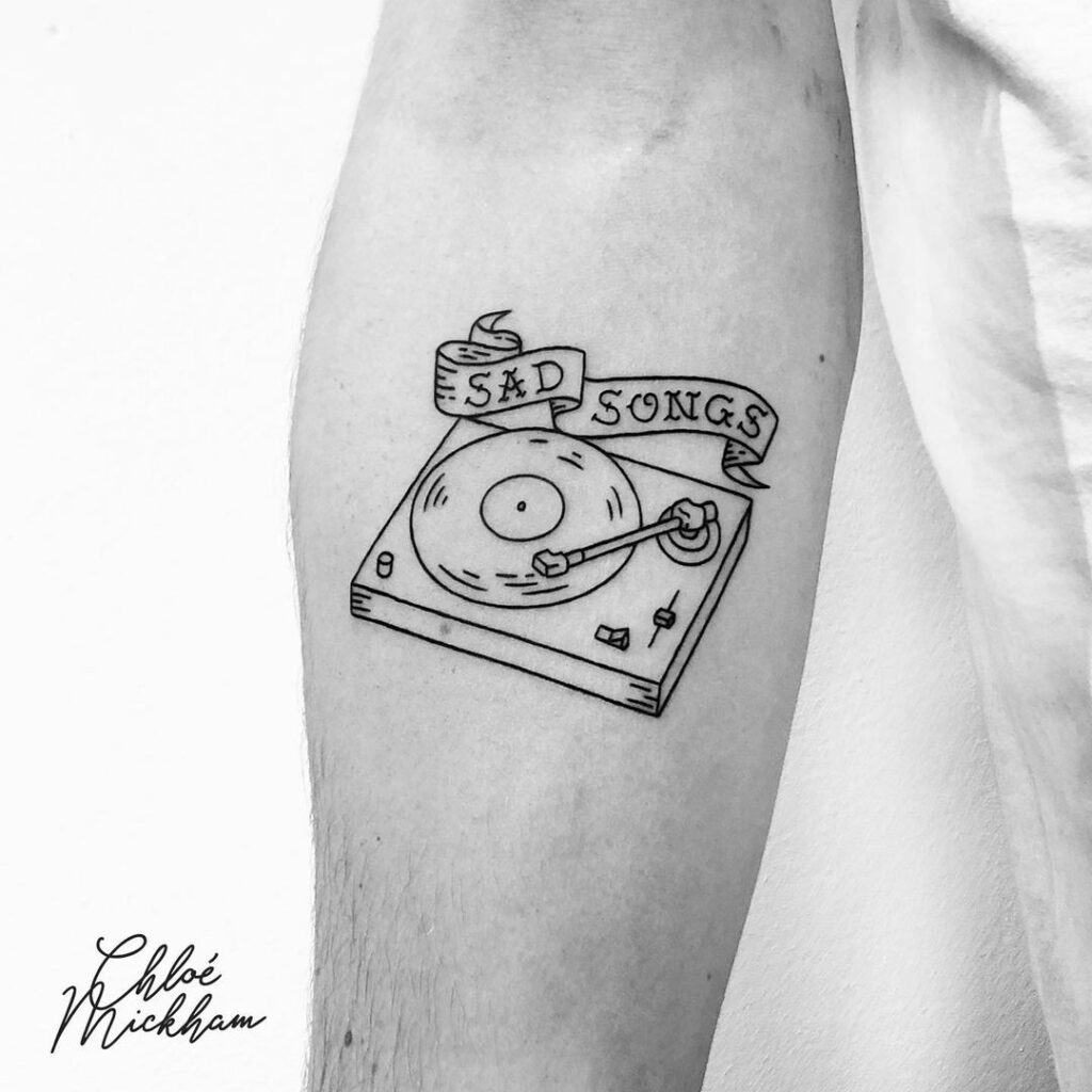 sad songs played on a turntable vintage tattoo