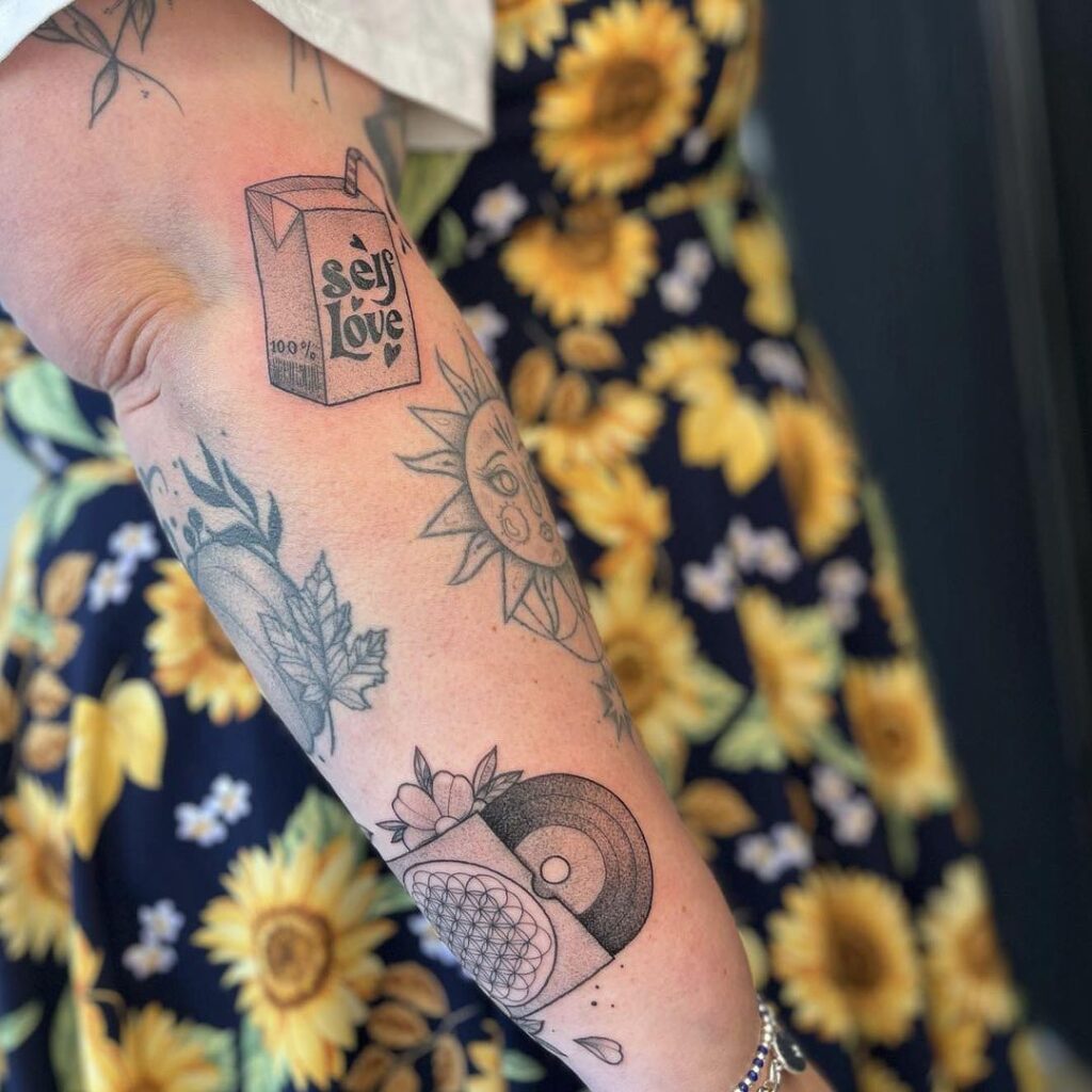 self love positivity patchwork sleeve tattoo