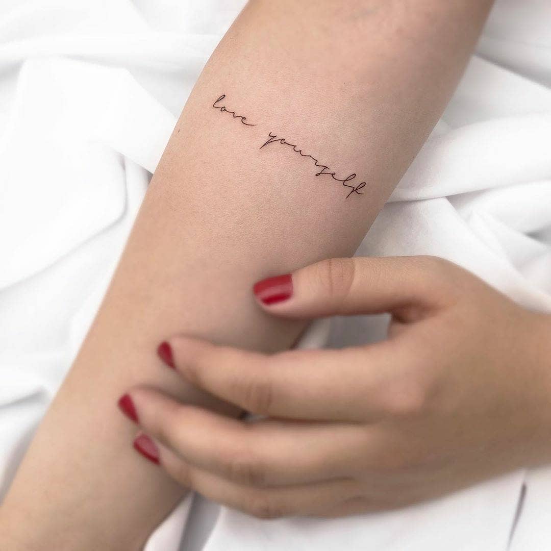 simple self-awareness forearm tattoo