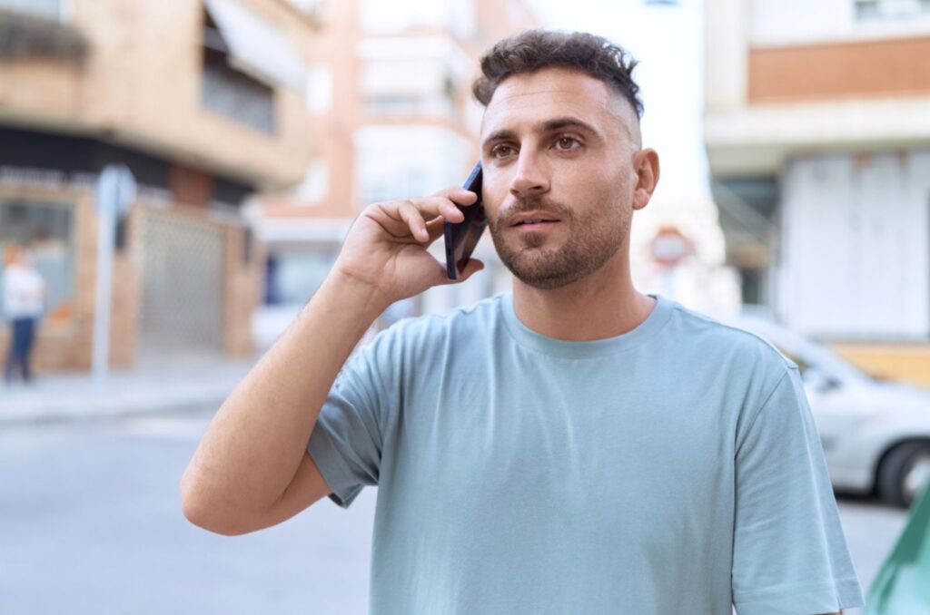 young man talking on phone