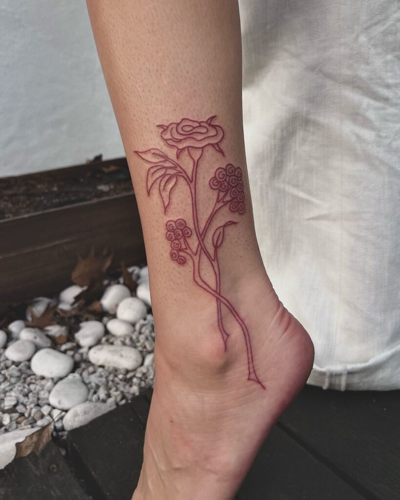 Red Ink Ankle Tattoo