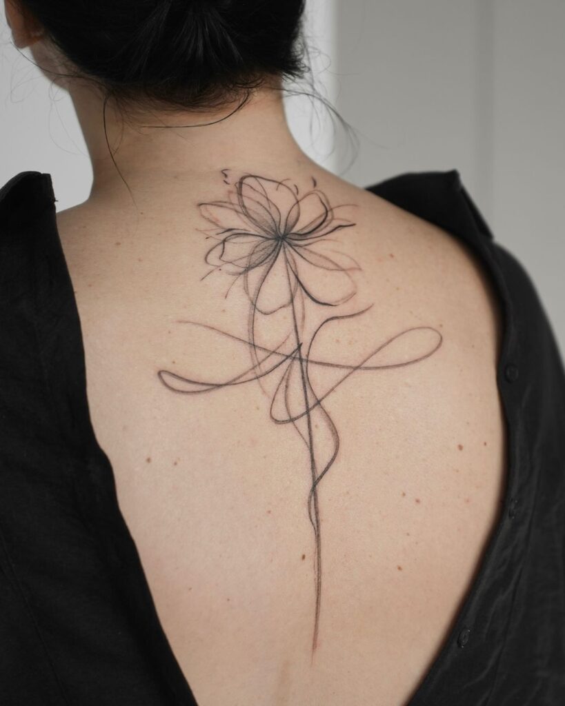 Tatuagem de flor abstrata