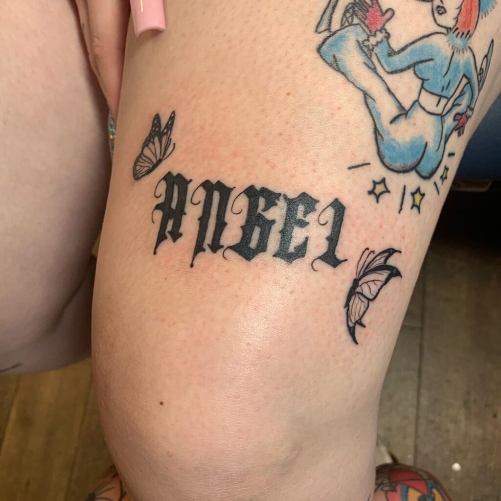 Angel Over The Knee Word Tattoo