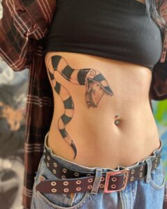 26 Bold And Cool Side Stomach Tattoos That Are Pure Art
