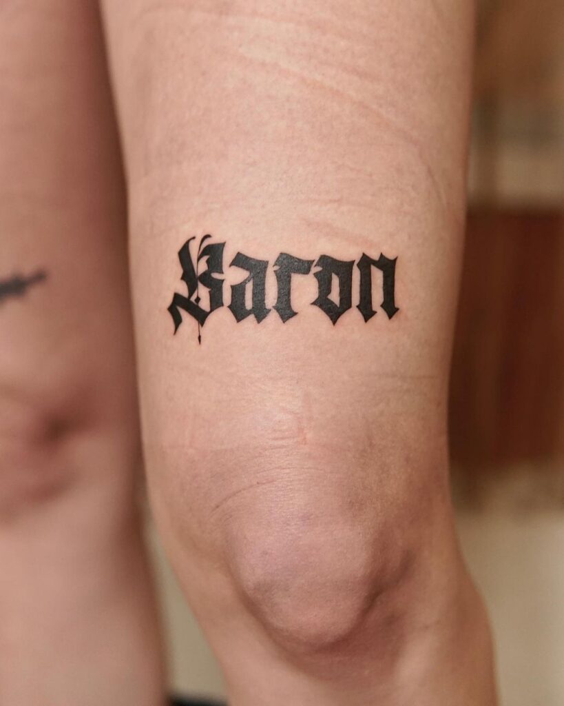 Dog's Name Over The Knee Word Tattoo