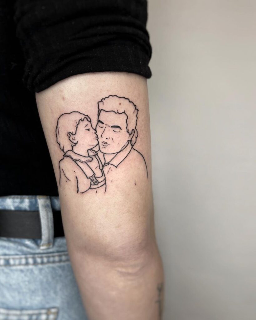 Tatuagem de retrato de pai e filha