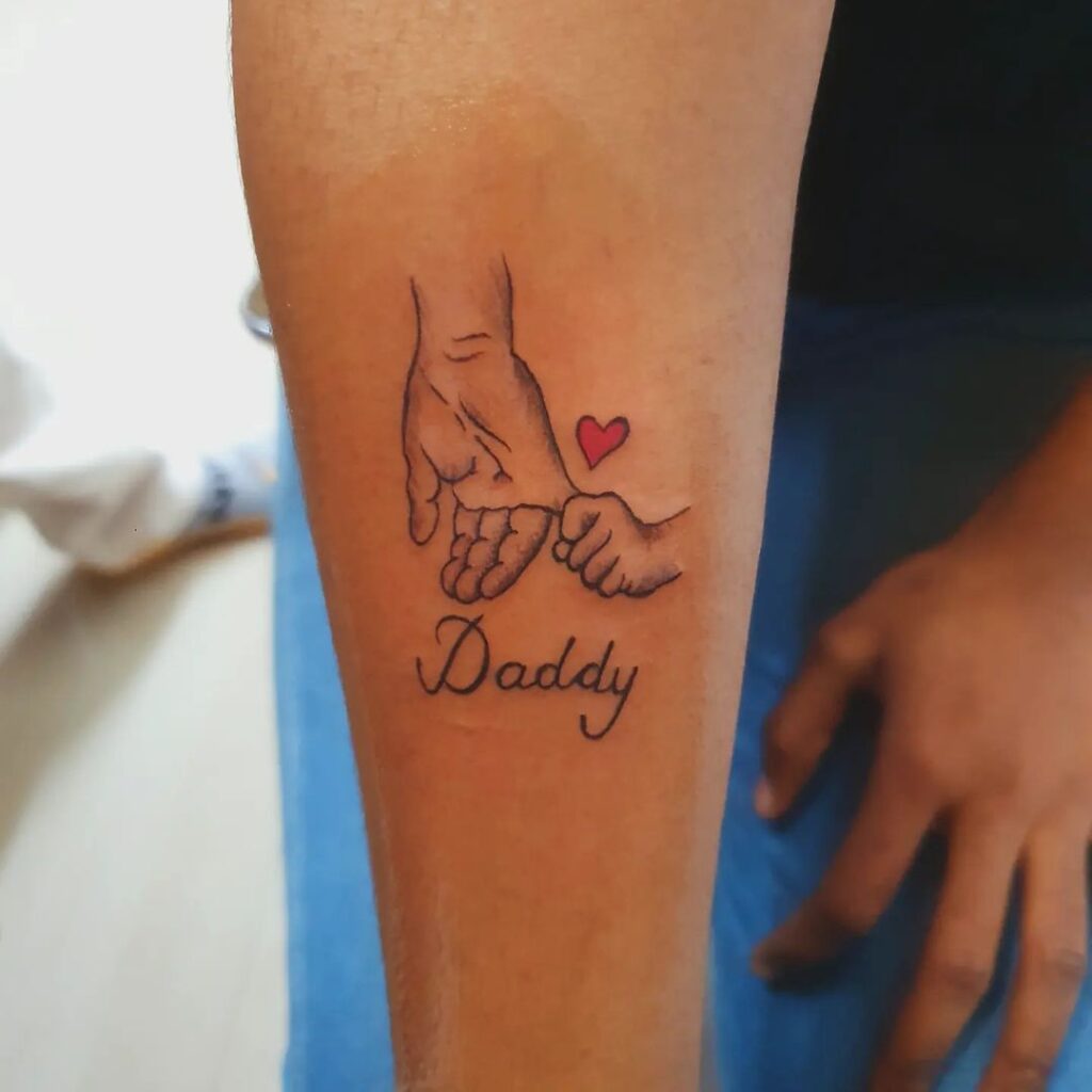 Holding Daddy's Finger Tattoo