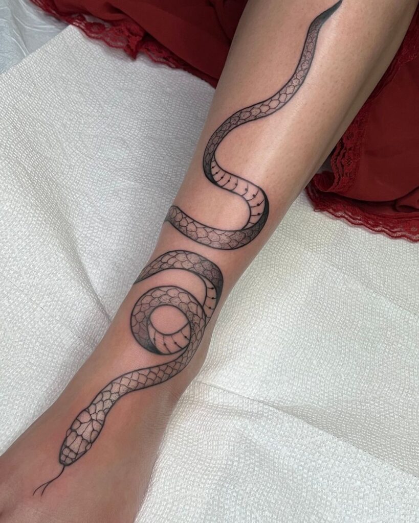 Sleek Serpent Leg Tattoo