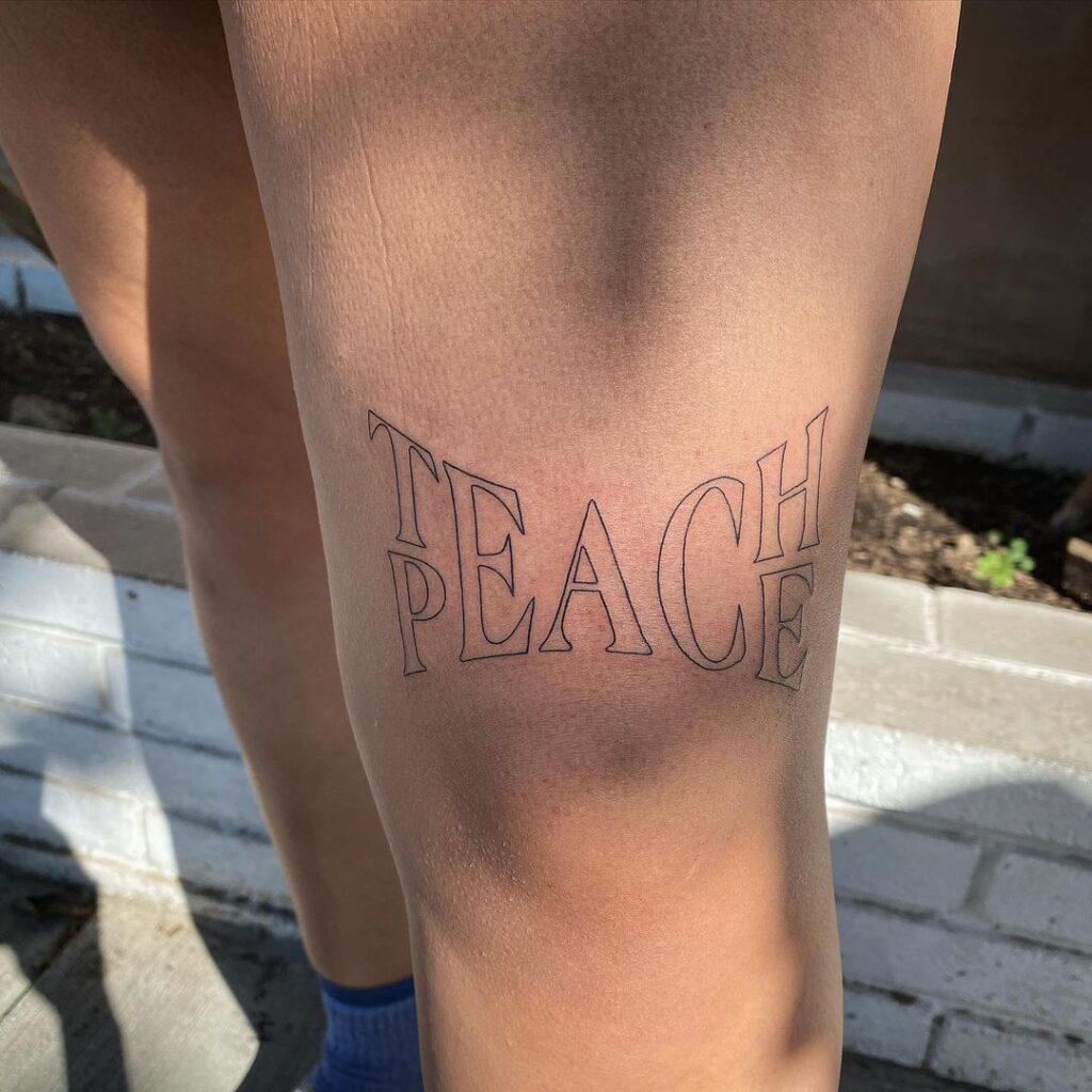 Teach Peace Over The Knee Tattoo