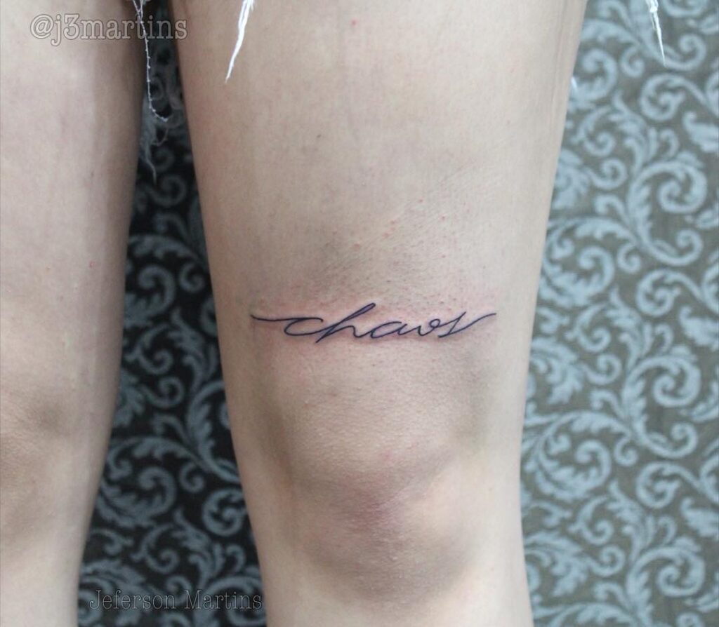 Chaos Cursive Above The Knee Tattoo