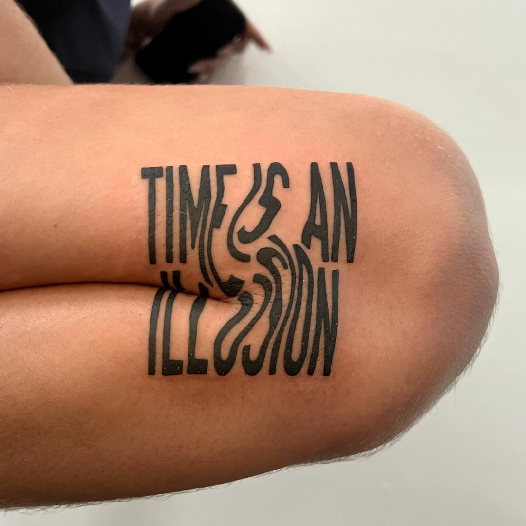 Contemporary Art-Inspired Lettering Tattoo