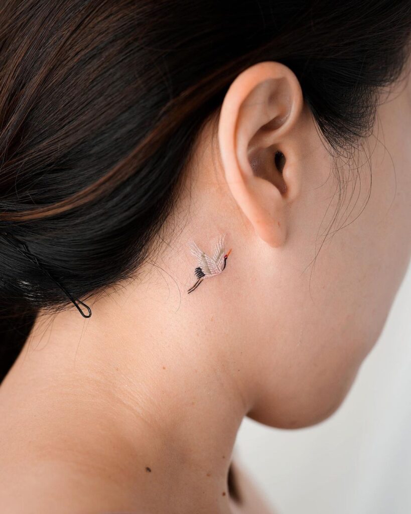 Crane Tat Behind The Ear