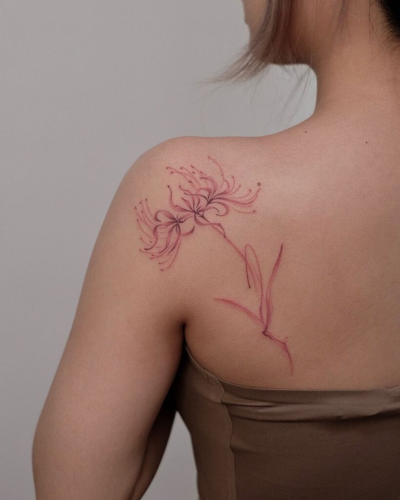 Tatuagem de linha fina de lírio-aranha vermelho