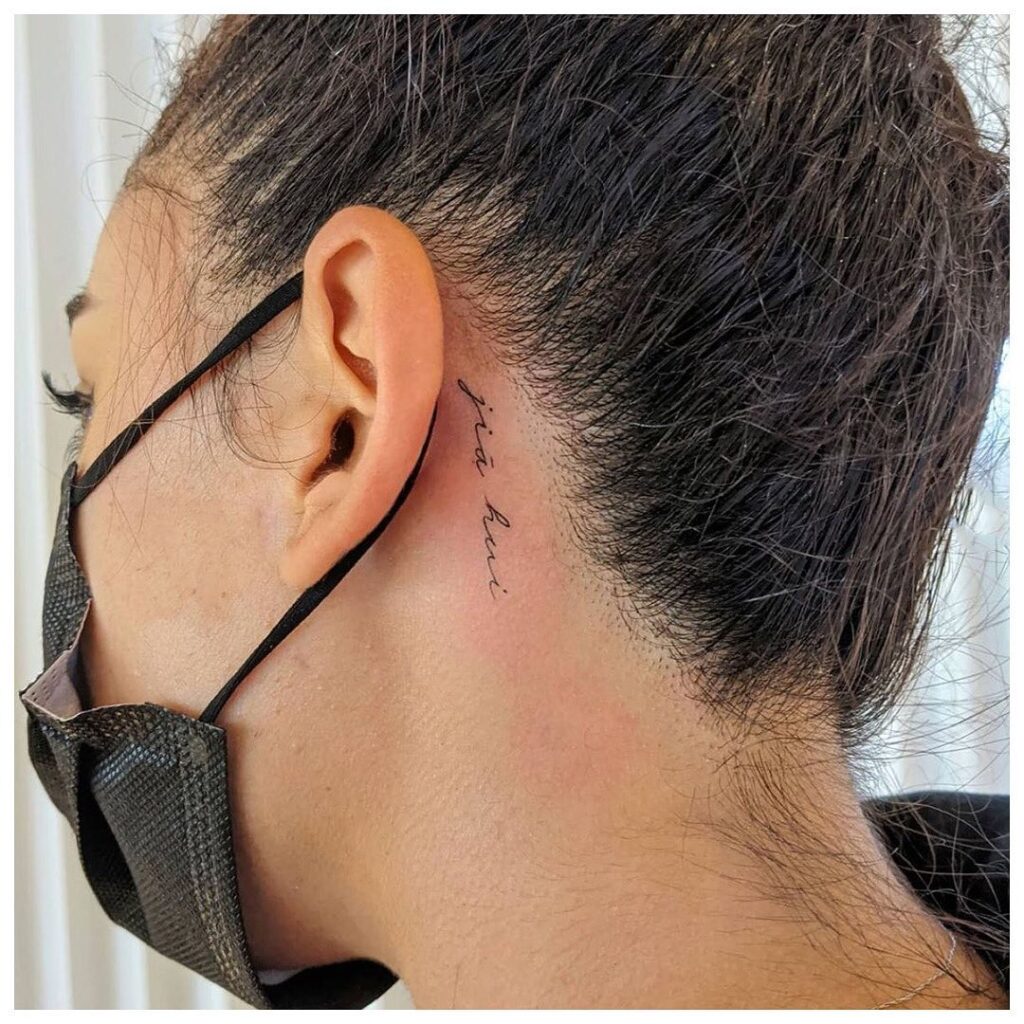 Fine Line Script Tattoo Behind The Ear