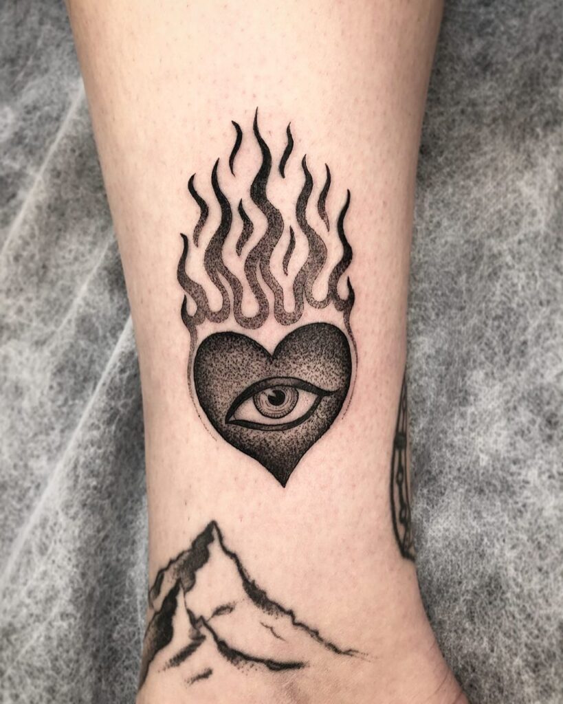 Fire Heart With Eye Tattoo