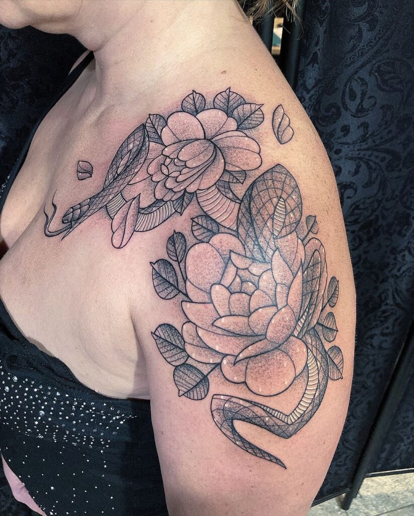 Freehand Snake And Flowers Tattoo