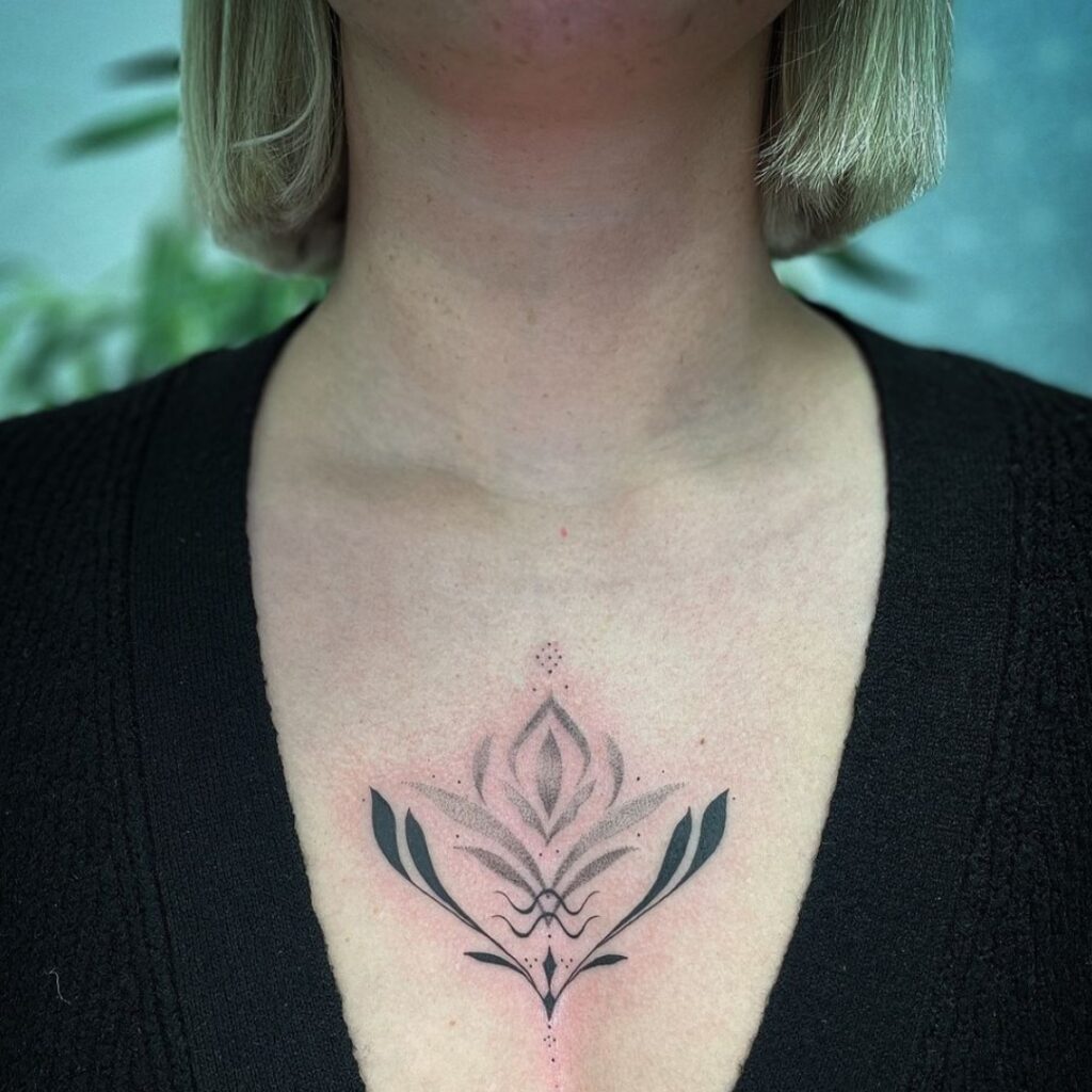 Geometric Lotus Chest Tattoo