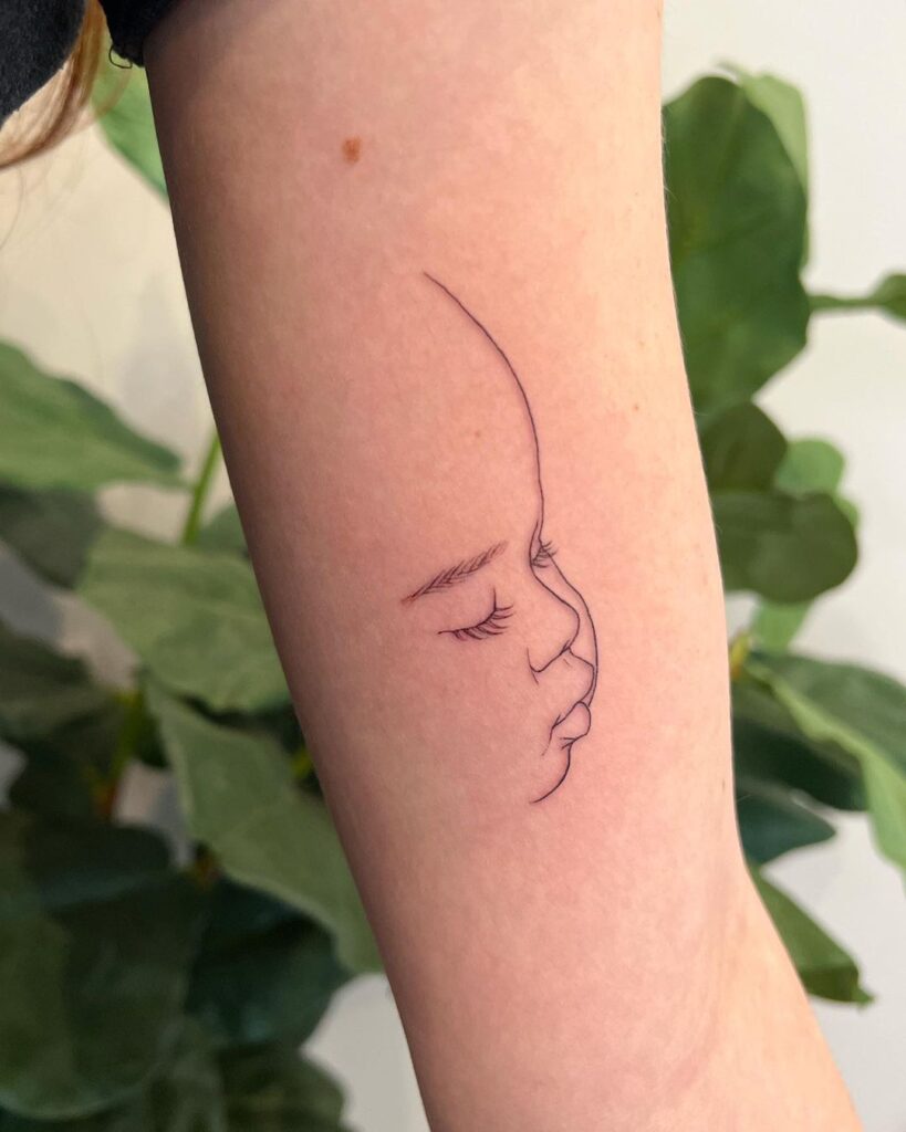 Minimalistic Baby Portrait Tattoo