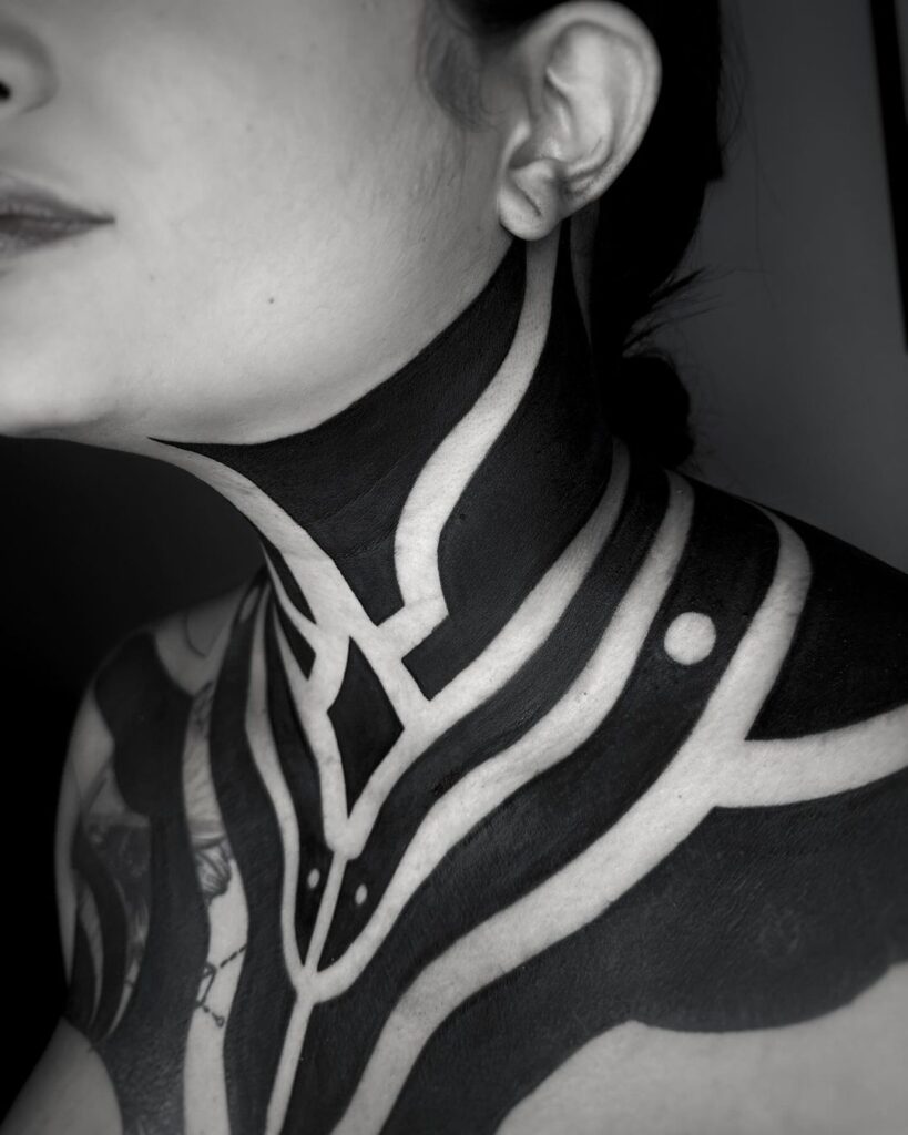 Neo Tribal Neck And Chest Tattoo