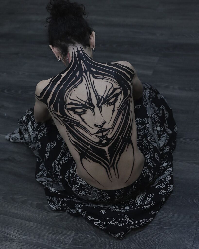 Neo Tribal Portrait Tattoo On The Back