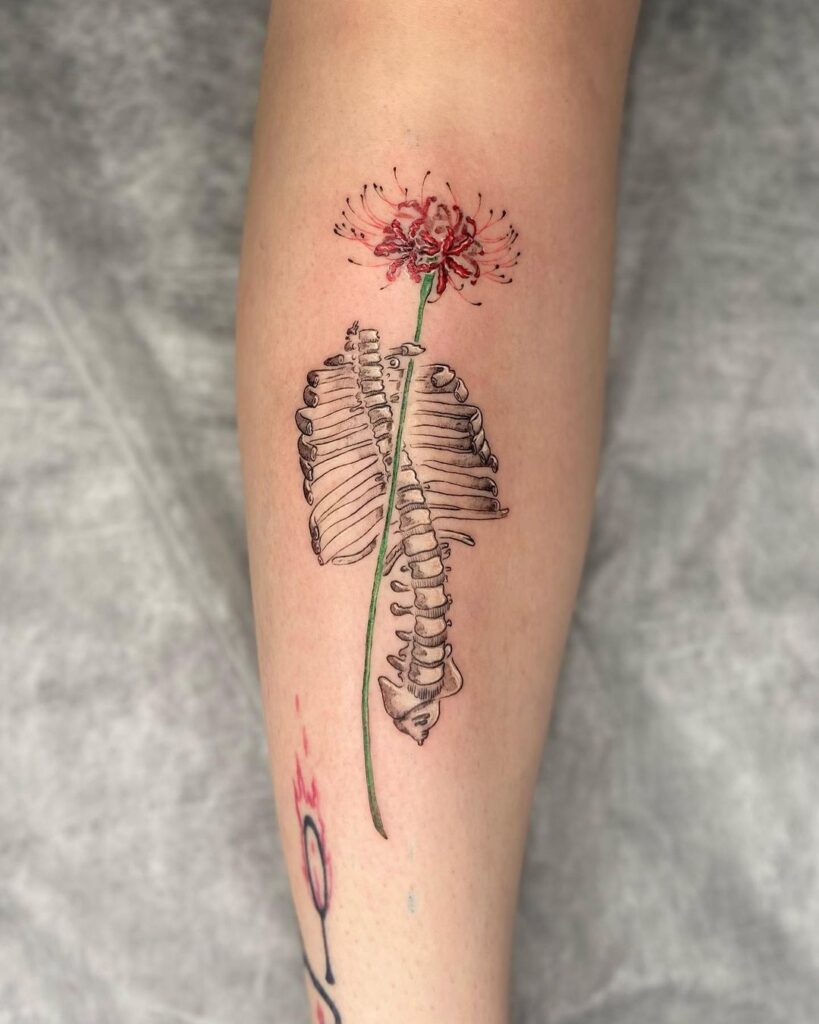 Red Spider Lily Growing Out Of Skeleton Tattoo